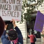 Protestors with signs