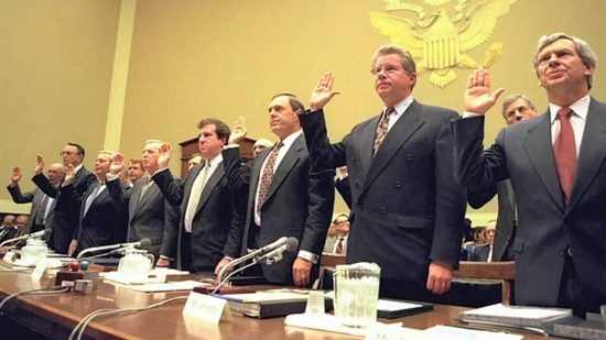 Men in suits taking an oath