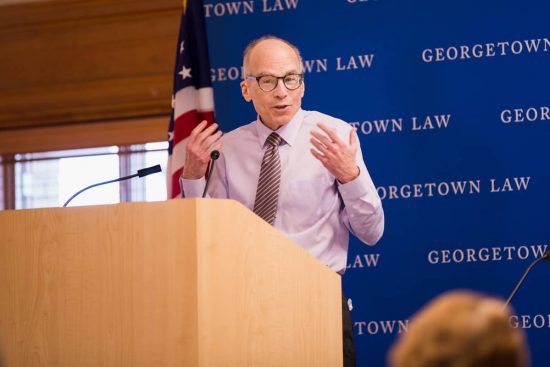 Lawrence Gostin speaking from a podium