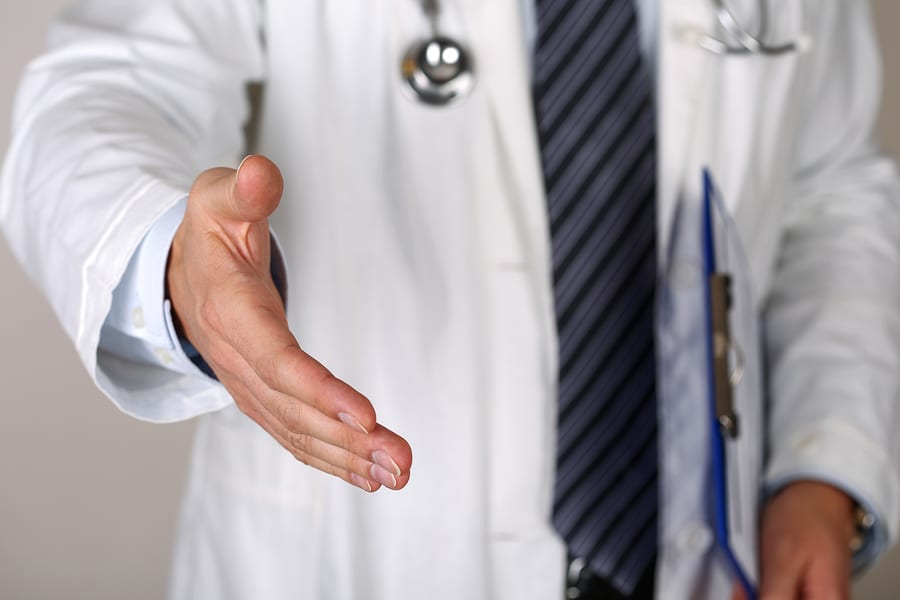 doctor reaching out to shake hands