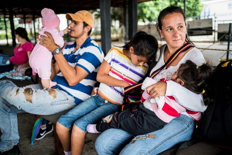 family sitting on a bench