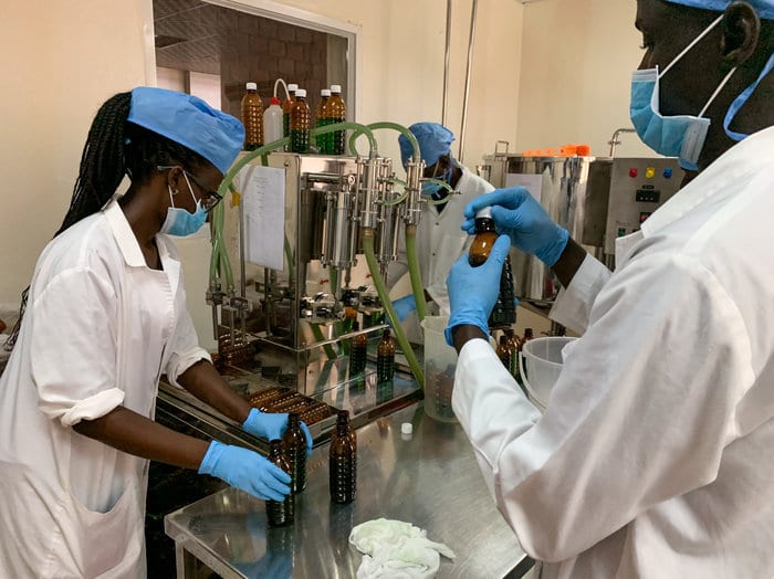 Health workers in Uganda prepare liquid morphine. 