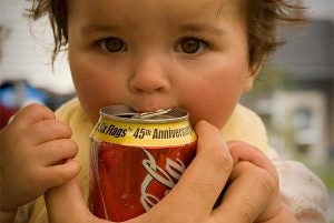 child drinking Coca Cola