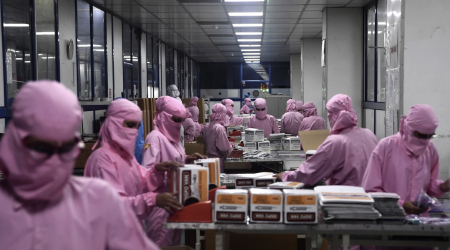 Workers in a vaccine manufacturing plant