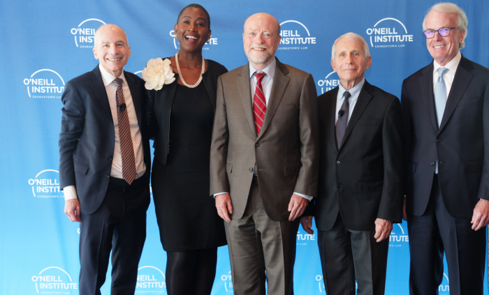 Dean William M. Treanor, Timothy J. O’Neill, Professor Michele Bratcher Goodwin, and Professor Lawrence O. Gostin