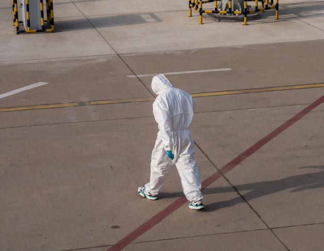 Person walking in hazmat suit