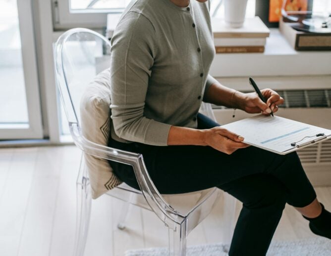 Photo of woman filling out a form