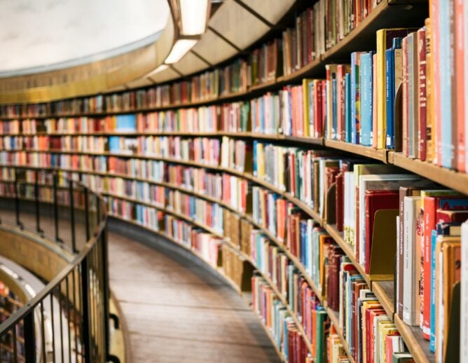 Stock image of bookshelves filled with books