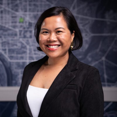 Headshot of Joan Dela Cruz